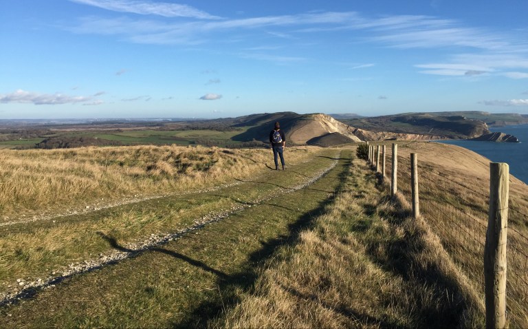Walking to Mupe Bay on the South West Coast Path, near Lulworth Cove, Dorset