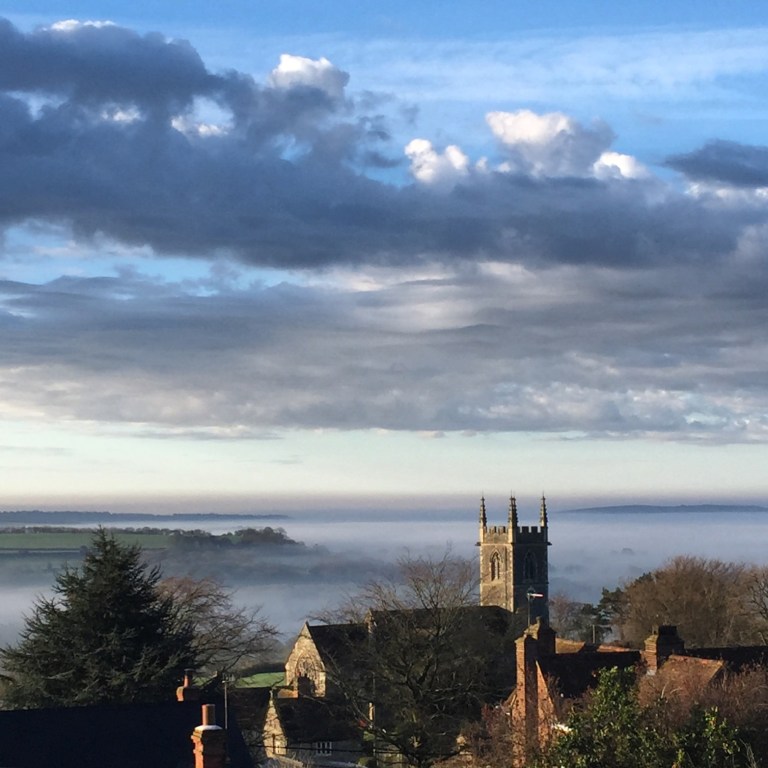 St James Church in Shaftesbury, Dorset, with low mist in the valley