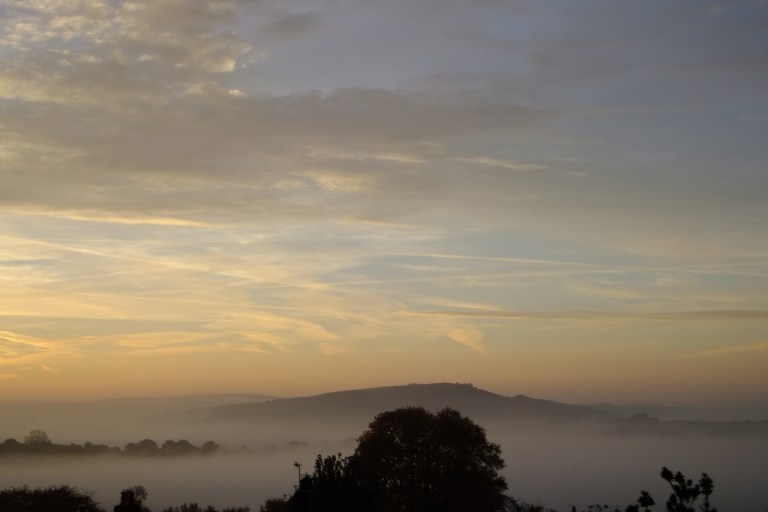 Melbury Hill in Dorset, UK, as seen from the town of Shaftesbury during a cloud inversion