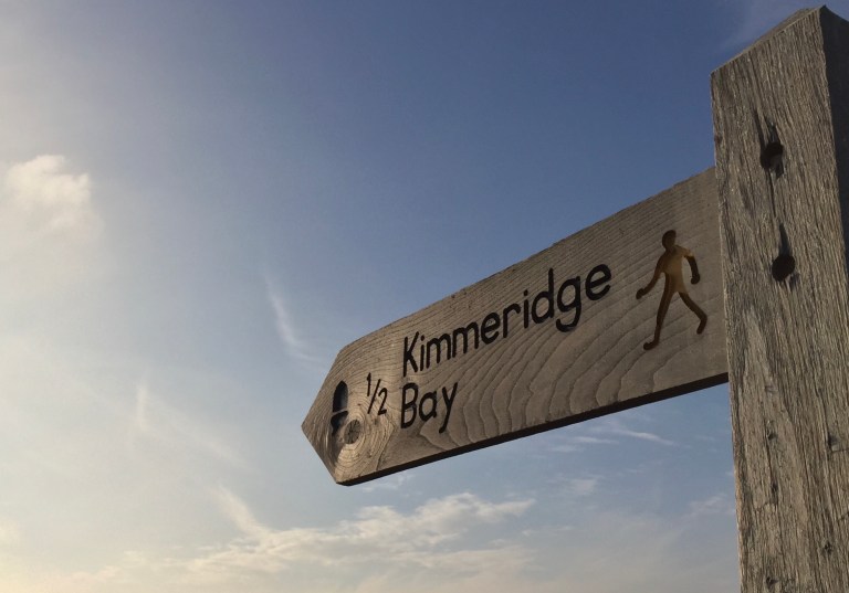 Signpost pointing to Kimmeridge Bay