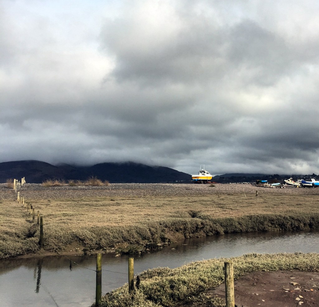 Boats and marshland at Porlock Weir, Exmoor, Somerset